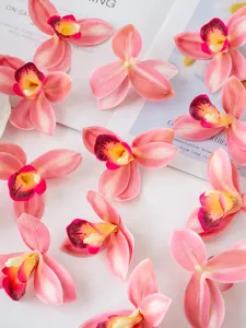Artificial film cymbidium orchid flowers for dessert table decor and ethnic headdress making.