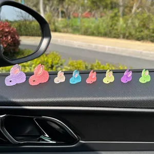 Mini luminous cute rabbit car dashboard ornament, compact size, colorful interior decor.