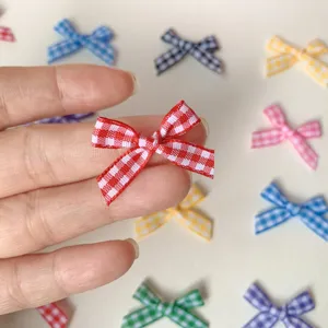 Mini checkered ribbon bow accessory for DIY craft, handmade hair accessories detail close-up.