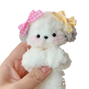 Handmade fuzzy wire puppy plush toy with cute bows, perfect for DIY crafts and cute accessories.