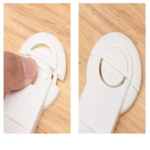 Detailed close-up showing the locking mechanism of a white child safety lock.