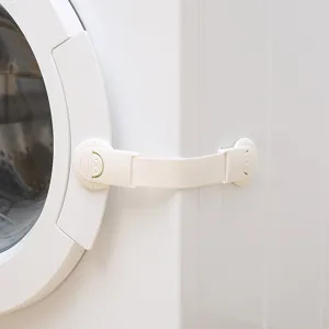 White adjustable baby safety lock installed on a washing machine door
