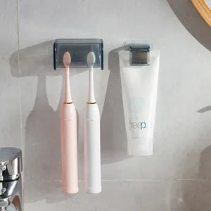 Portaspazzolino e dentifrice a parete senza fori in un ambiente bagno grigio