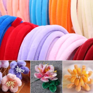 Detail shot of colorful fluffy chenille stems and handmade DIY plush flower craft materials.