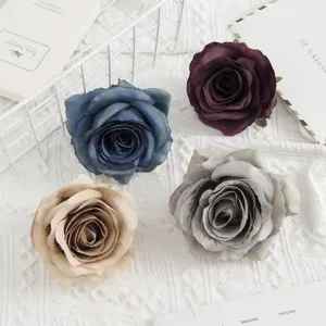 Artificial rose flower head detail shot, perfect for wedding bouquets and photography props.