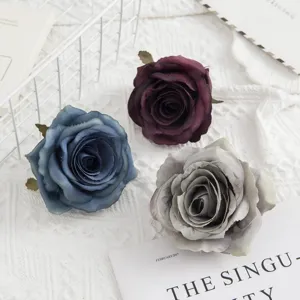 Artificial rose flower heads for wedding bouquets, home decor and photography props.