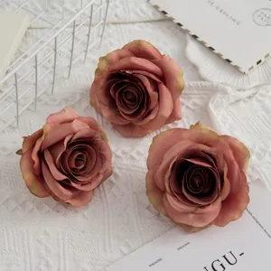 Detailed close-up view of vintage pink artificial rose flower heads for photography and decor.