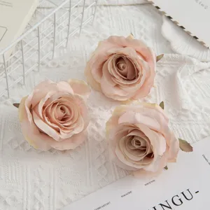 Artificial rose flower heads for wedding bouquets, home decor, and photography props.
