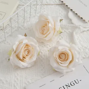 Artificial champagne rose flower heads for wedding home decor and DIY photography props.