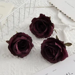 Artificial dark red rose heads for wedding bouquets, home decoration and photography props.