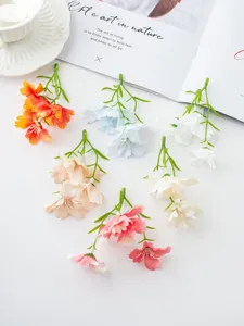 Artificial small orchid flower detail shot, multi-color DIY floral accessory for home decor.