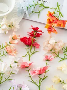 Artificial miniature orchid flower heads for DIY hair accessories and home craft decoration details.