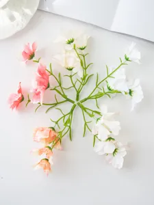 Close-up detail view of colorful artificial orchid flower stems for creative DIY crafts.