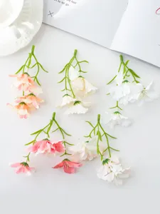 Artificial miniature orchid flower heads for DIY crafts, floral arrangements, and home decor.
