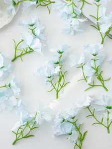 Artificial blue flower stem detail close up for diy craft hair accessories and home decoration.
