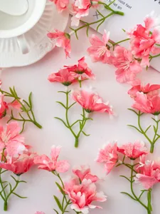 Close-up detail of artificial pink orchid flowers, perfect for DIY crafts and home decor.