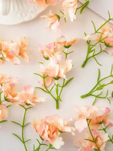 Artificial small orchid flowers peach pink silk floral accessories for DIY home decor.