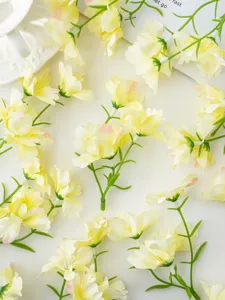 Artificial small orchid flower branches for DIY home decoration and craft accessories.