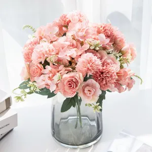 Detailed view of Nordic artificial pink hydrangea and peony flower arrangement in glass vase.