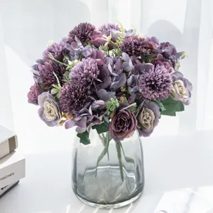 Detailed view of Nordic artificial hydrangea and peony bouquet in grey glass vase.