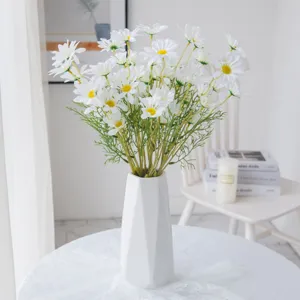 White artificial daisy bouquet with ceramic vase for home decoration and wedding floral arrangement.