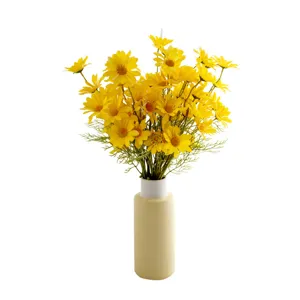 Artificial yellow daisy flower bouquet in ceramic vase for home decor wedding table setup