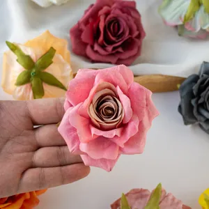 Close-up detail shot of artificial curled rose flower heads, vibrant colors for DIY crafts.