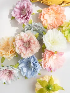 Artificial silk peony flower heads detail view, colorful floral craft material for DIY wreaths.