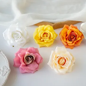 Close-up detail view of artificial rolled edge rose flower heads for DIY crafts and decor.