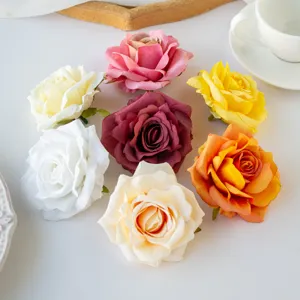 Artificial rolled edge rose flower heads for DIY crafts, wreaths, and floral backdrops.