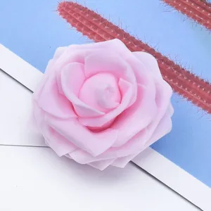 Close-up detail of artificial pink foam rose head, perfect for DIY wedding bouquets and crafts.
