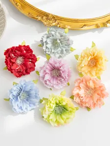 Artificial peony flower heads for DIY hair accessories, colorful silk floral decoration detail.