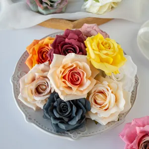 Artificial rose flower heads detail shot, multi-color DIY craft floral decor material.