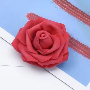 Close-up of vibrant red artificial foam rose flower head, ideal for DIY wedding decor.