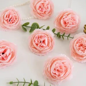 Detailed shot of 8cm artificial silk peony flower heads in pink, perfect for wedding and decor.