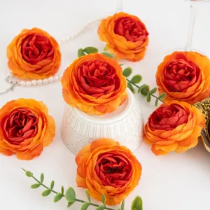 Orange artificial peony flower detail shot, perfect for floral arrangement decor and photo props.