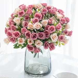 Artificial rose flower bouquet with glass vase for home wedding decoration and party styling.