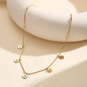 Detailed view of a gold stainless steel necklace featuring delicate flower charms