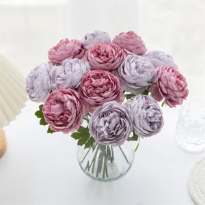Artificial peony flower bouquet detail view, elegant home decor table centerpiece.