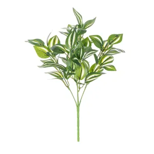 Detailed view of artificial variegated green plant leaves, perfect for home desktop decor.