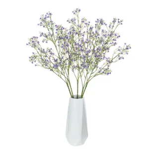 Artificial purple gypsophila detail view, elegant floral arrangement in white geometric ceramic vase.