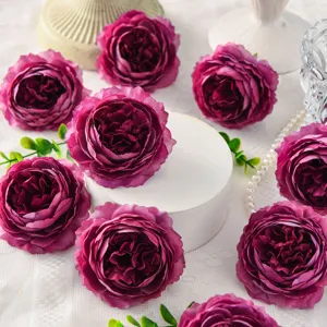 Close-up detail of 8cm artificial peony silk flowers for wedding decoration and gift box.