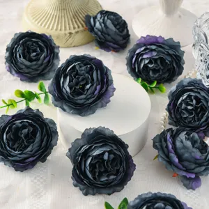 Artificial peony flower head detail, dark gray silk floral decor for wedding background and box.