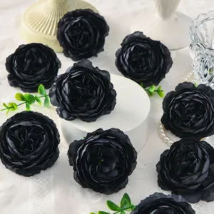 Artificial black peony silk flowers detail shot, decorative floral arrangement for wedding.