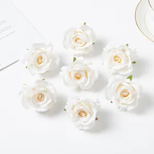 Artificial silk rose heads for DIY floral arrangements, wedding decor, and photography props.