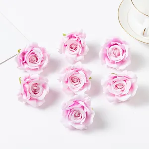 Artificial silk rose heads in pink, perfect for DIY floral arrangements, wedding and photography props.
