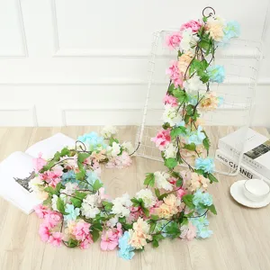 Detailed view of artificial flower vine garland, multi-color decorative floral for wedding home.