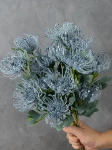Artificial spider chrysanthemum flower detail, grey flocked faux floral bunch for home decor.