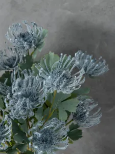 Artificial flocked chrysanthemum flower head detail close up view for home decor.