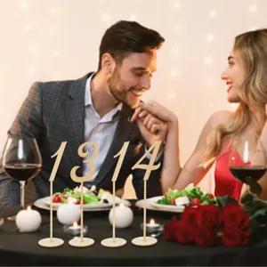 Wooden table number 1314 sign displayed in a romantic wedding dining scene setup.
